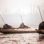 Pescadores no Lago Anchar, Srinagar, Caxemira